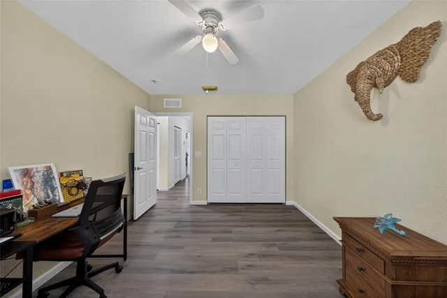 a view of a workspace with furniture and a workspace