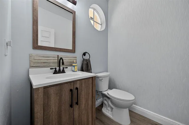 a front view of a house with lots of potted plants