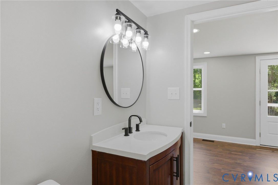 3497 Bumpass Road Beaverdam, VA 23015 - Photo 12 of 28 Bathroom featuring a dark wood-finish vanity with