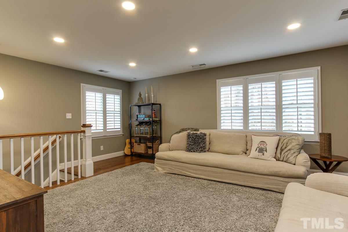 7904 Ogden Court Raleigh, NC 27613 - Photo 16 of 25 a living room with furniture and a large window
