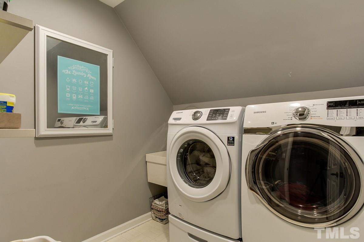7904 Ogden Court Raleigh, NC 27613 - Photo 18 of 25 a utility room with dryer and washer