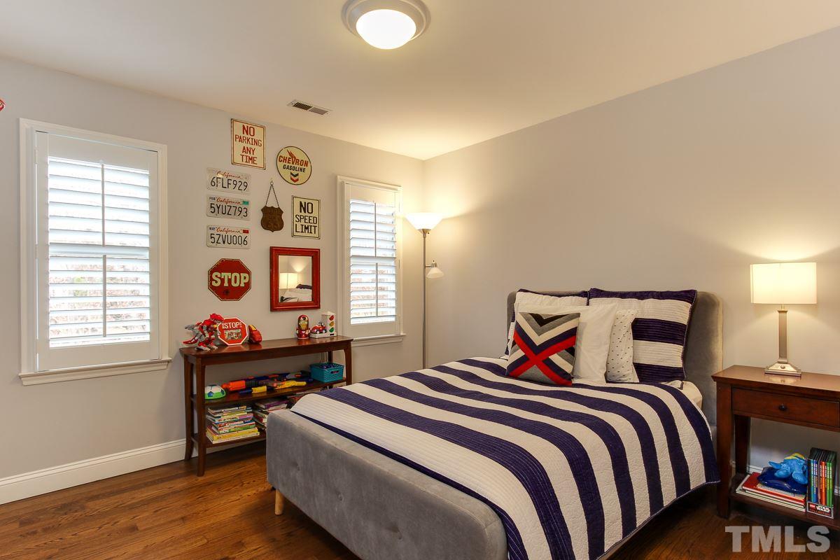 7904 Ogden Court Raleigh, NC 27613 - Photo 20 of 25 a bedroom with a bed and a window