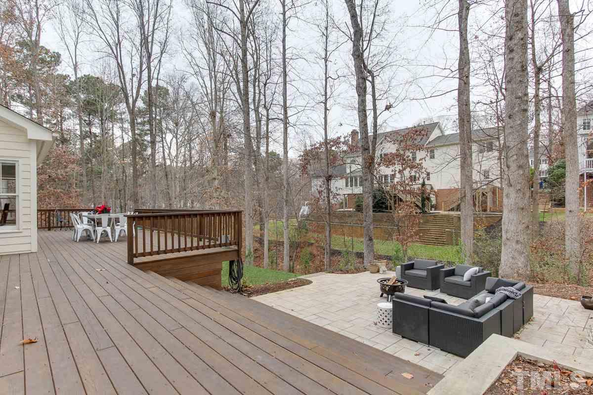 7904 Ogden Court Raleigh, NC 27613 - Photo 24 of 25 a balcony with wooden floor and outdoor seating