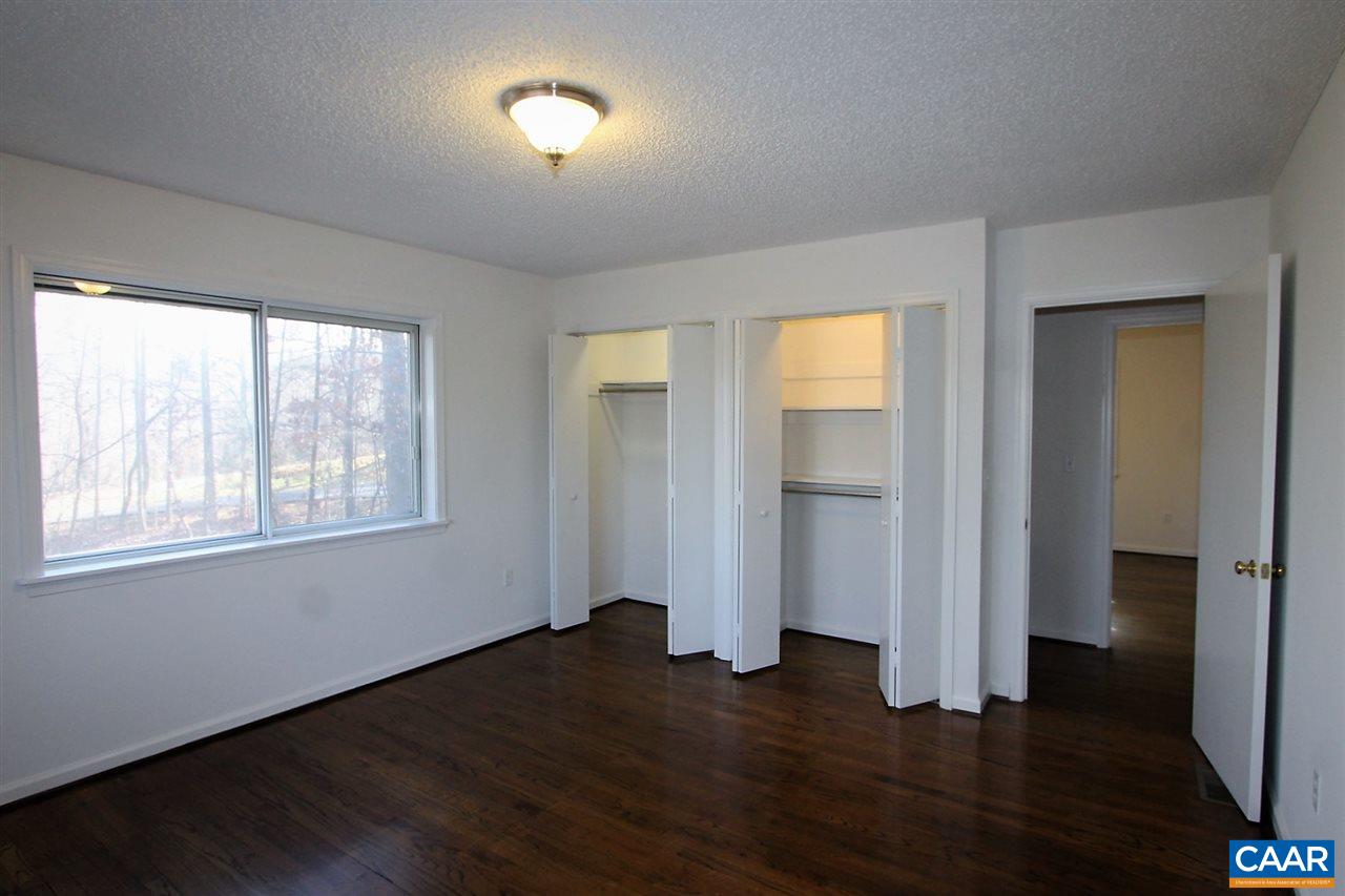 896 Dry Bridge Road Charlottesville, VA 22903 - Photo 20 of 47 an empty room with wooden floor and windows