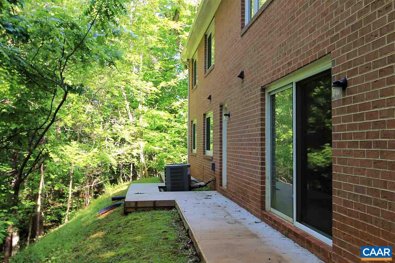 896 Dry Bridge Road Charlottesville, VA 22903 - Photo 43 of 47 a view of a backyard with plants and large tree