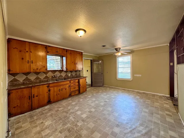 a large bathroom with a sink and a large mirror