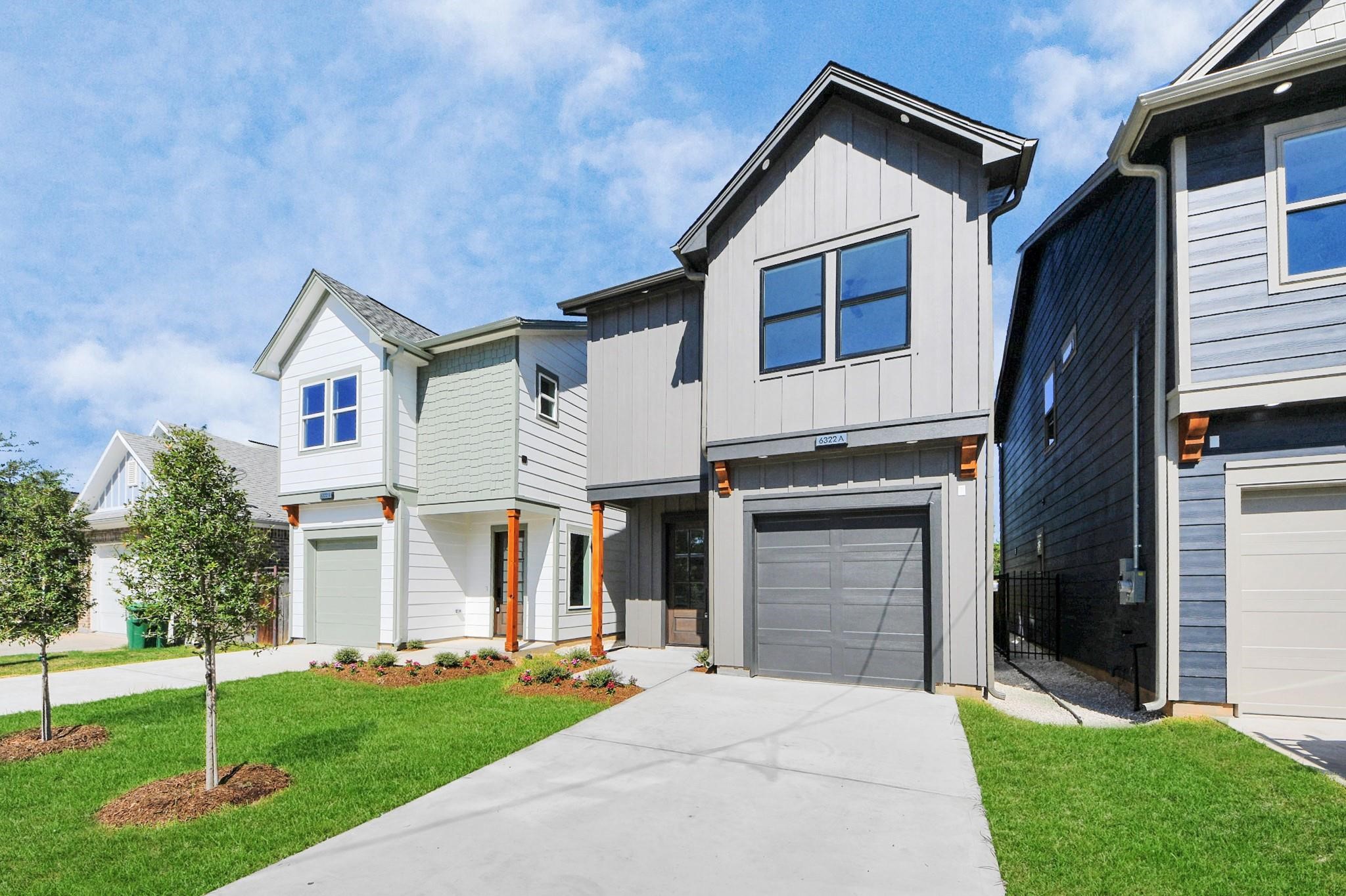6320 Milwee Street, Unit B Houston, TX 77092 - Photo 2 of 30 a front view of a house with a yard and garage