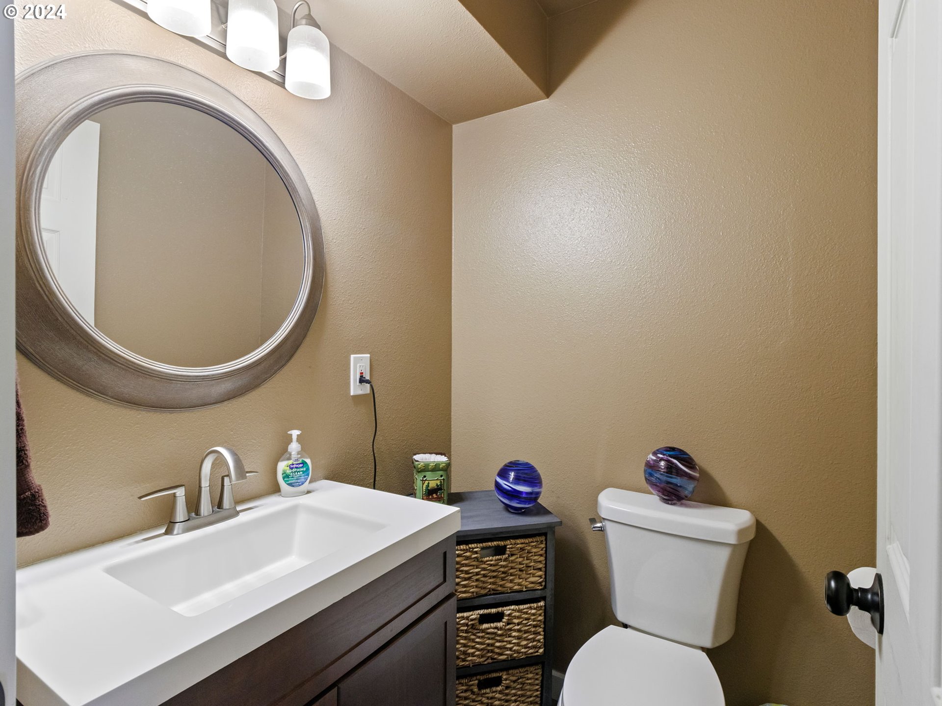 2551 Southeast Barnes Road Gresham, OR 97080 - Photo 18 of 38 a bathroom with a sink mirror and toilet