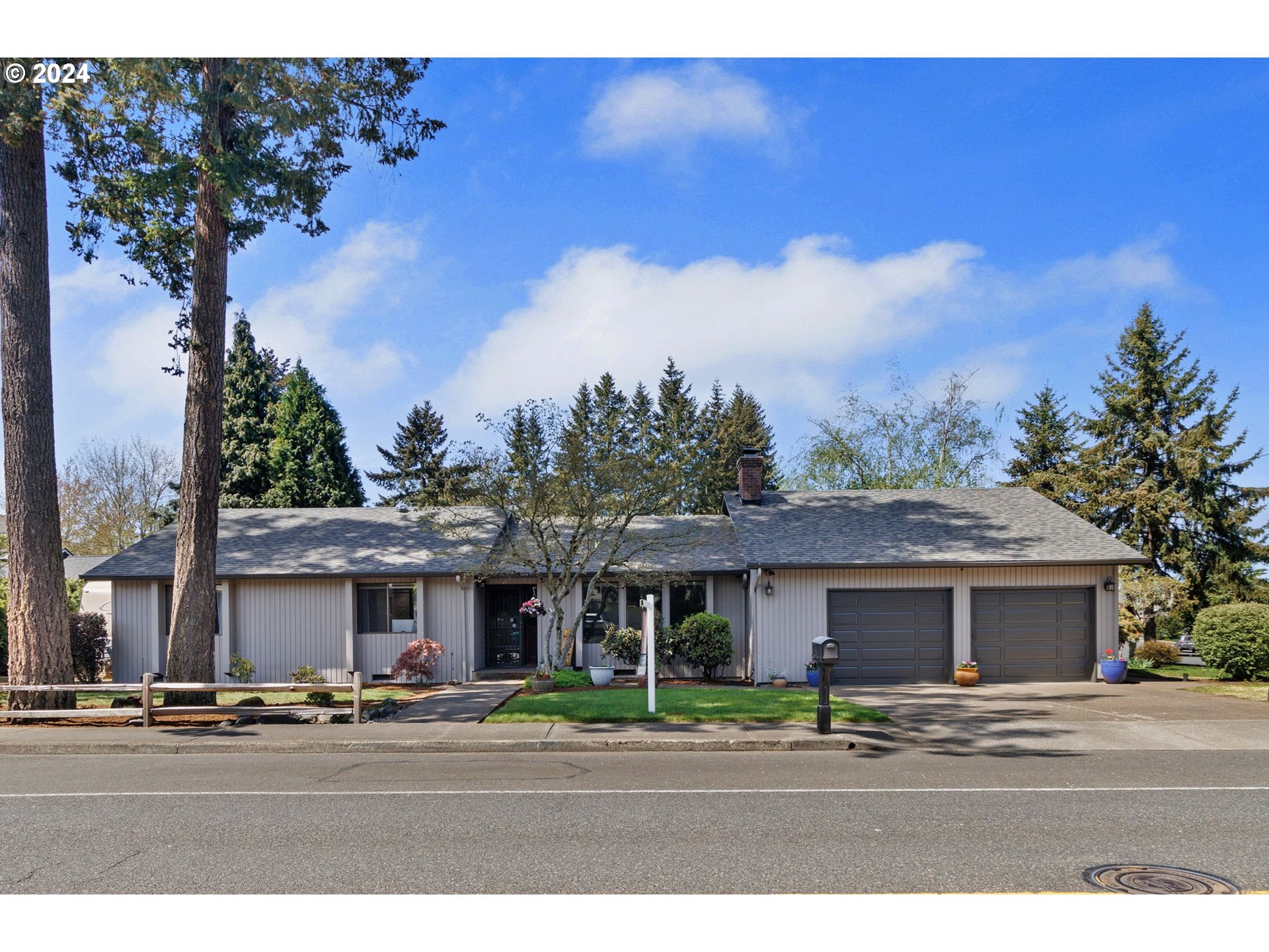 2551 Southeast Barnes Road Gresham, OR 97080 - Photo 2 of 38 a front view of a house with a yard