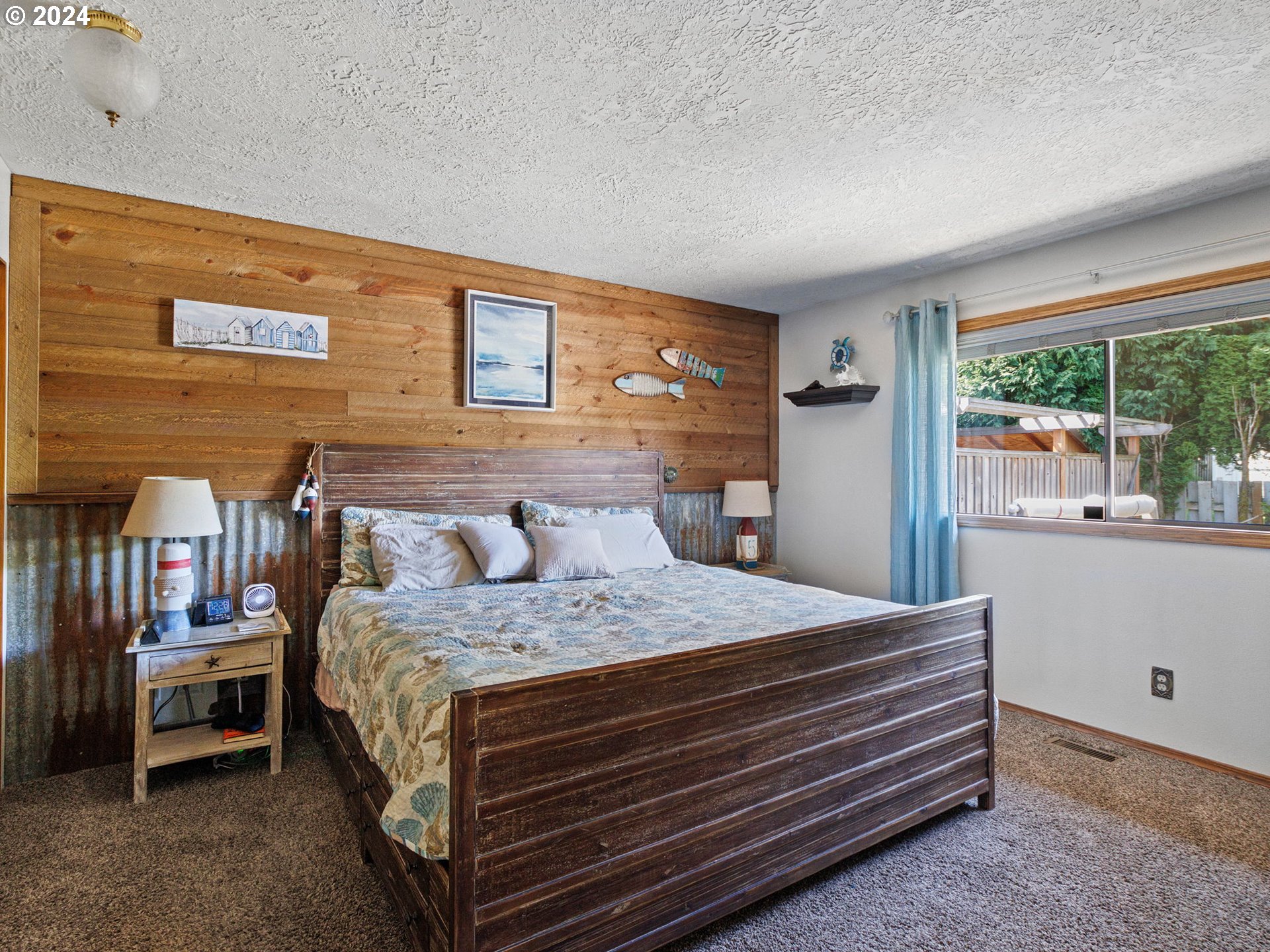2551 Southeast Barnes Road Gresham, OR 97080 - Photo 26 of 38 a bedroom with a bed and large window