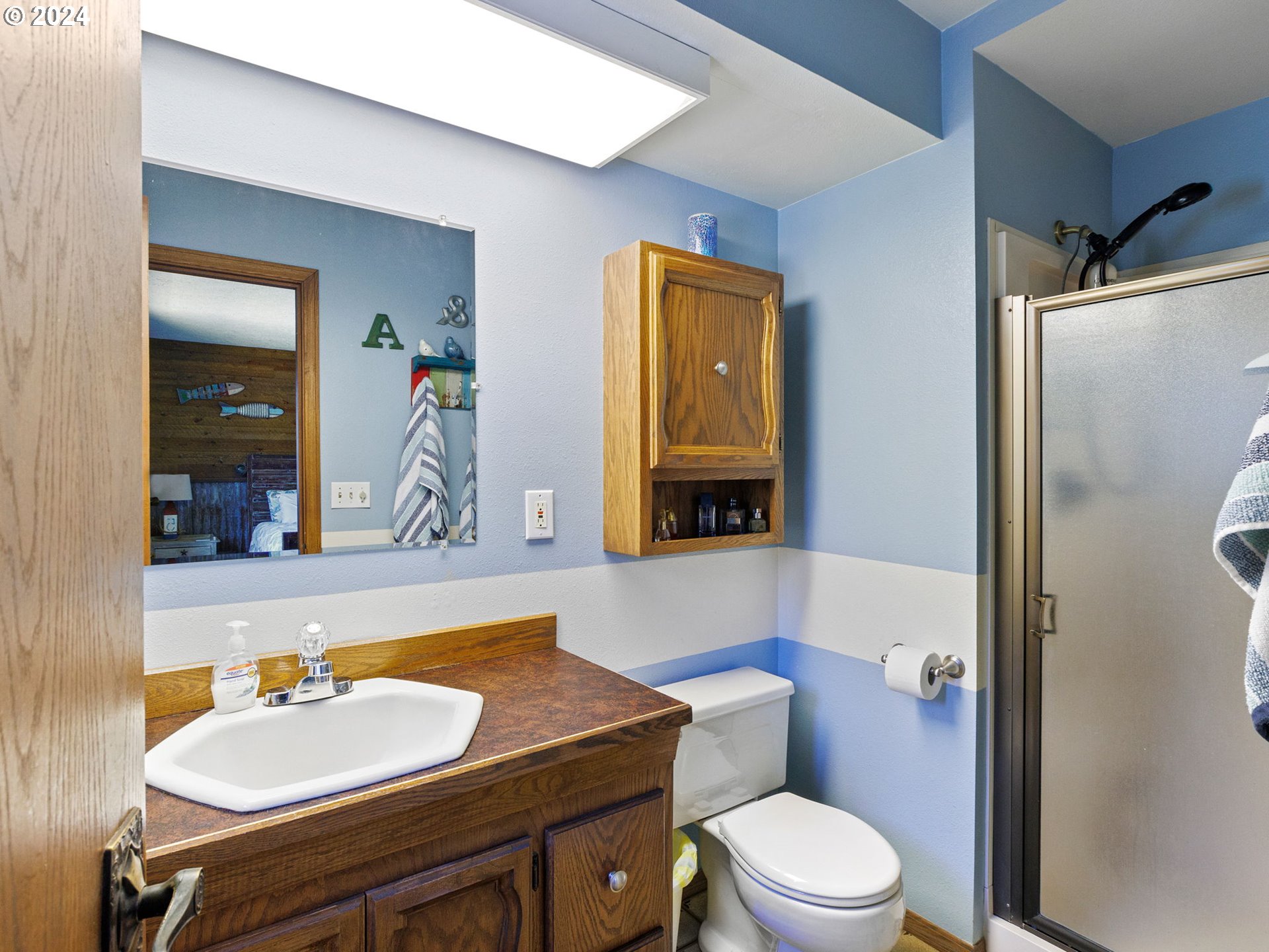 2551 Southeast Barnes Road Gresham, OR 97080 - Photo 28 of 38 a bathroom with a sink a toilet and shower
