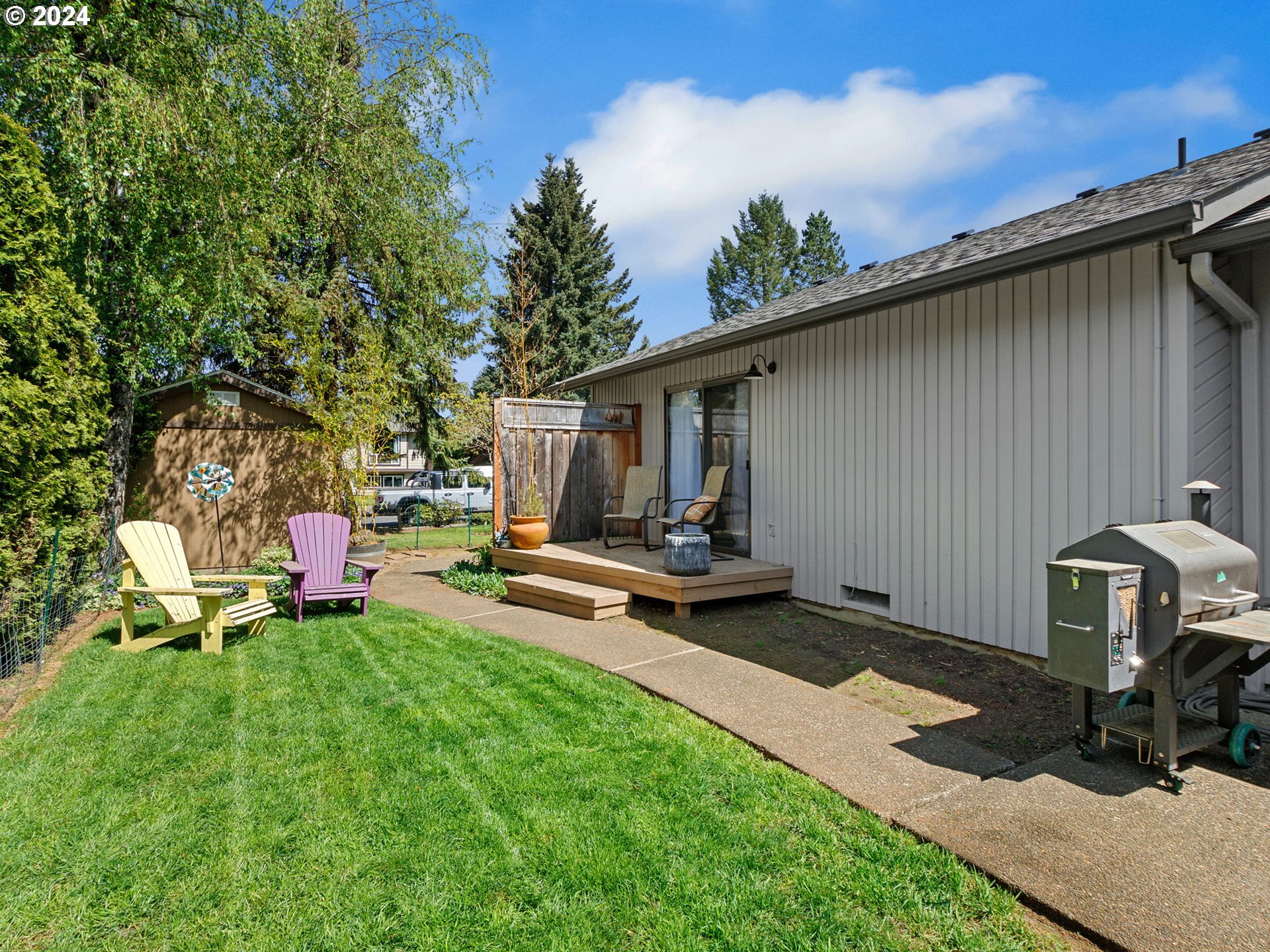 2551 Southeast Barnes Road Gresham, OR 97080 - Photo 30 of 38 a view of a backyard with furniture and a tub