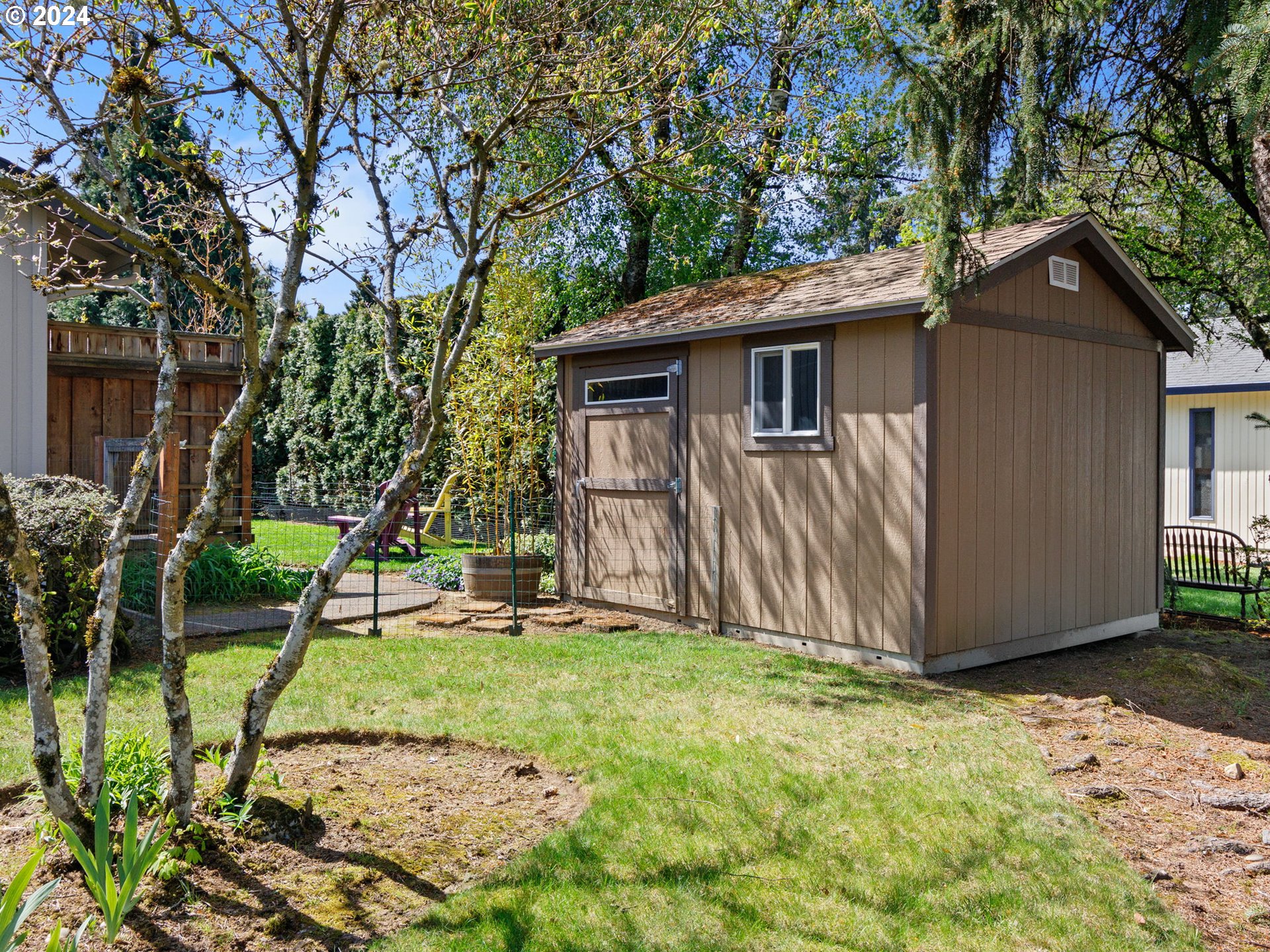 2551 Southeast Barnes Road Gresham, OR 97080 - Photo 33 of 38 a view of a house with a yard and large tree