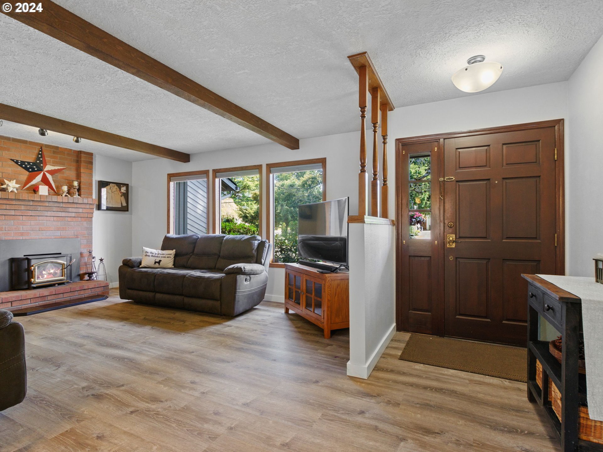 2551 Southeast Barnes Road Gresham, OR 97080 - Photo 4 of 38 a living room with furniture and a fireplace