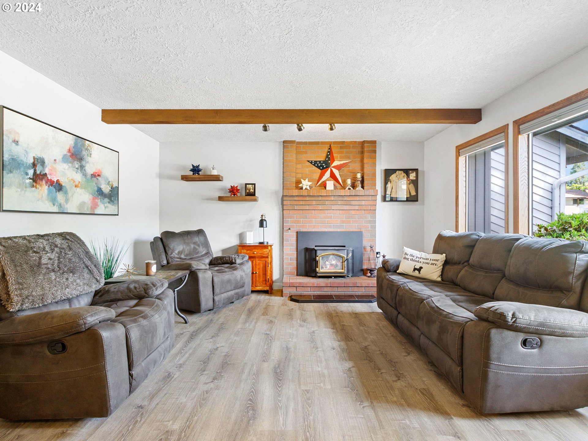 2551 Southeast Barnes Road Gresham, OR 97080 - Photo 5 of 38 a living room with furniture and a fireplace