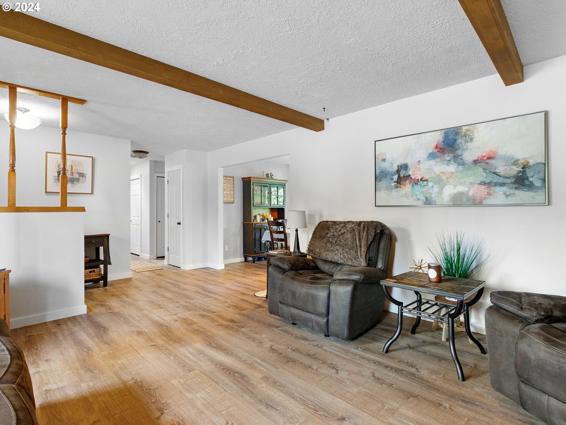 2551 Southeast Barnes Road Gresham, OR 97080 - Photo 6 of 38 a living room with furniture and a flat screen tv