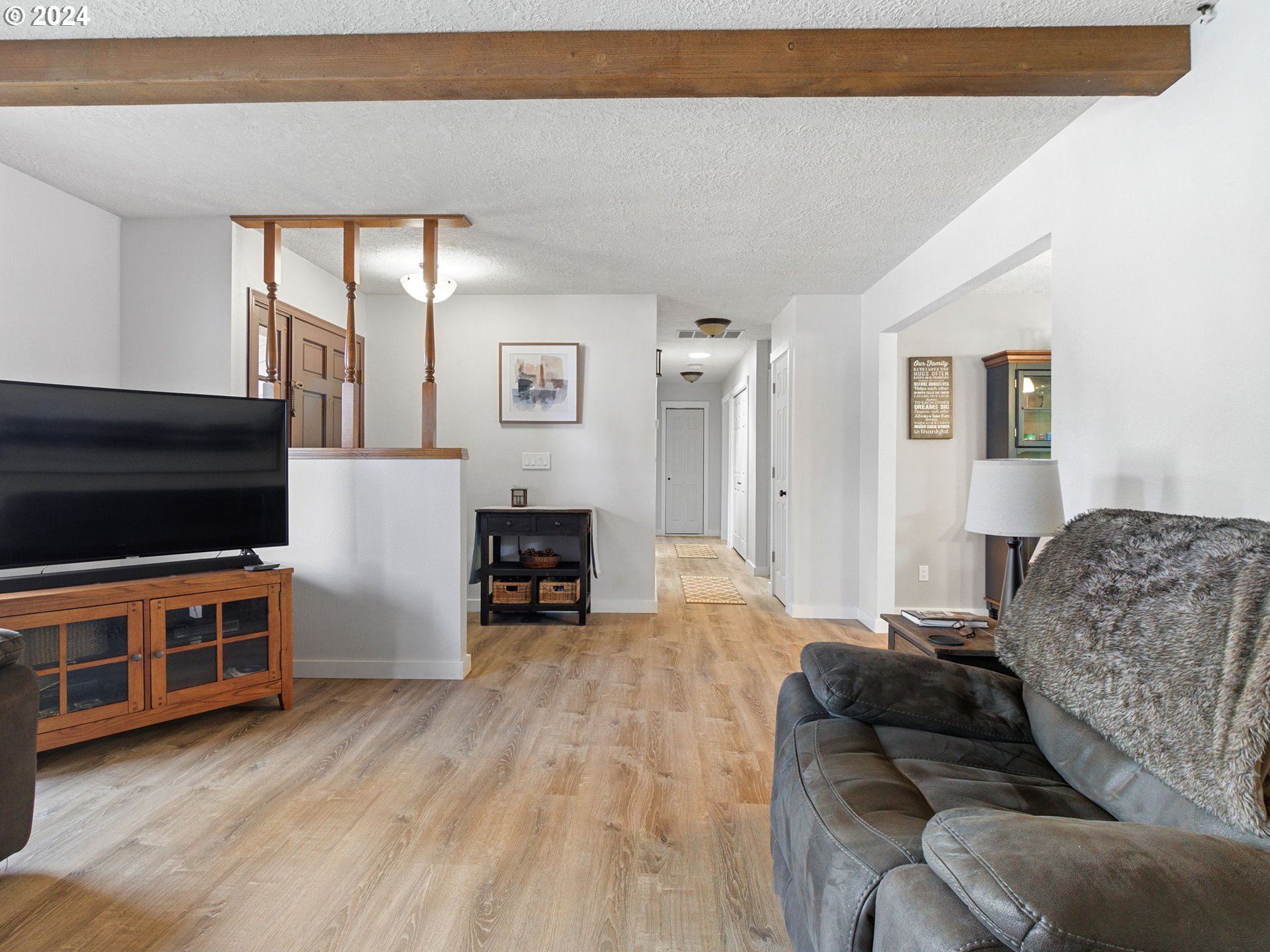 2551 Southeast Barnes Road Gresham, OR 97080 - Photo 7 of 38 a living room with furniture and a flat screen tv