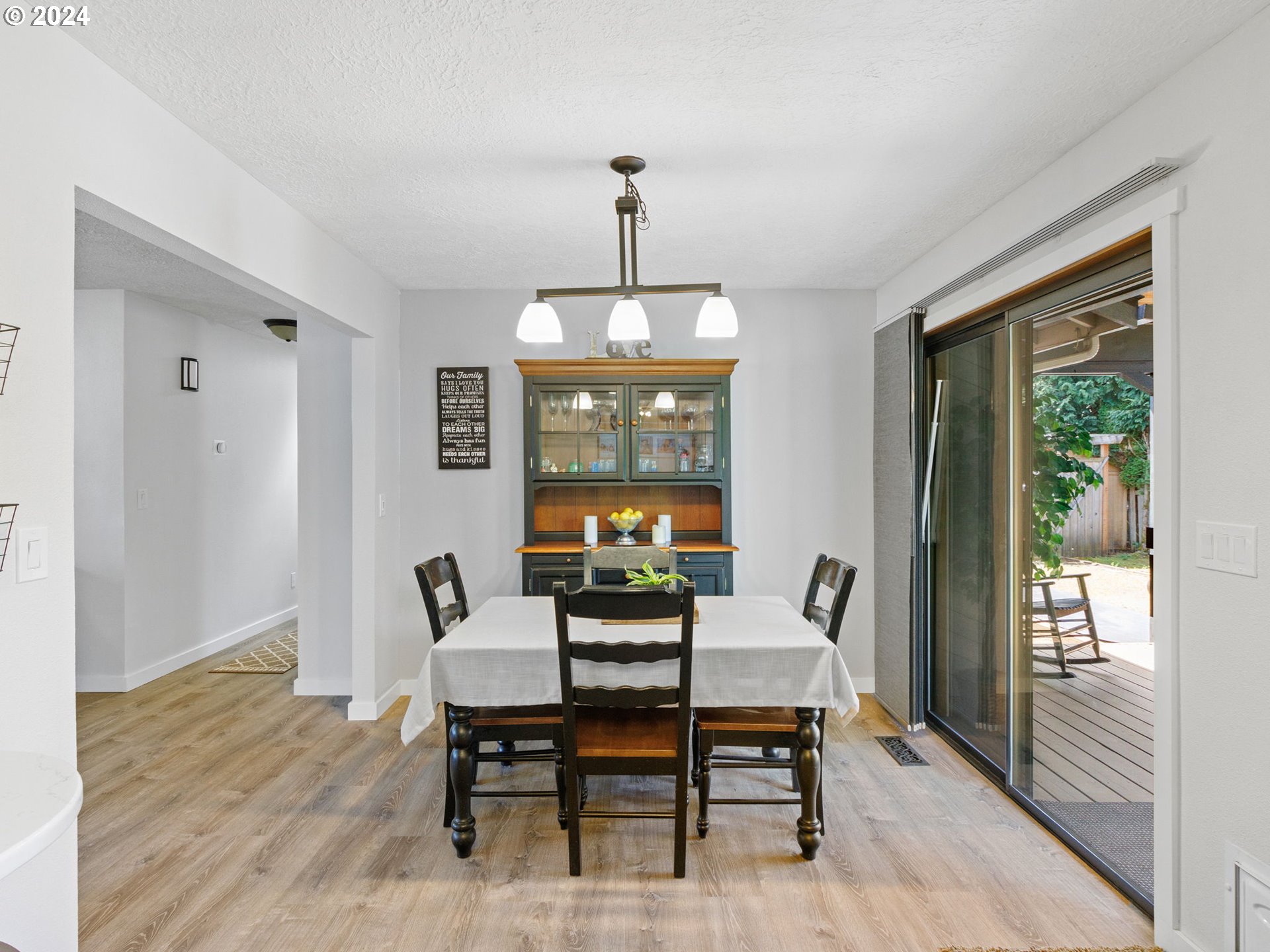 2551 Southeast Barnes Road Gresham, OR 97080 - Photo 10 of 38 a dining room with furniture window and wooden floor