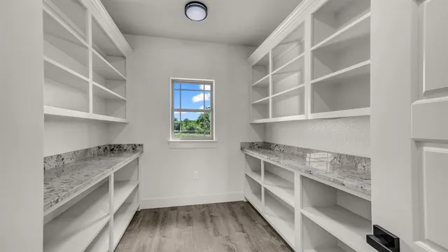 a kitchen with a cabinets and window