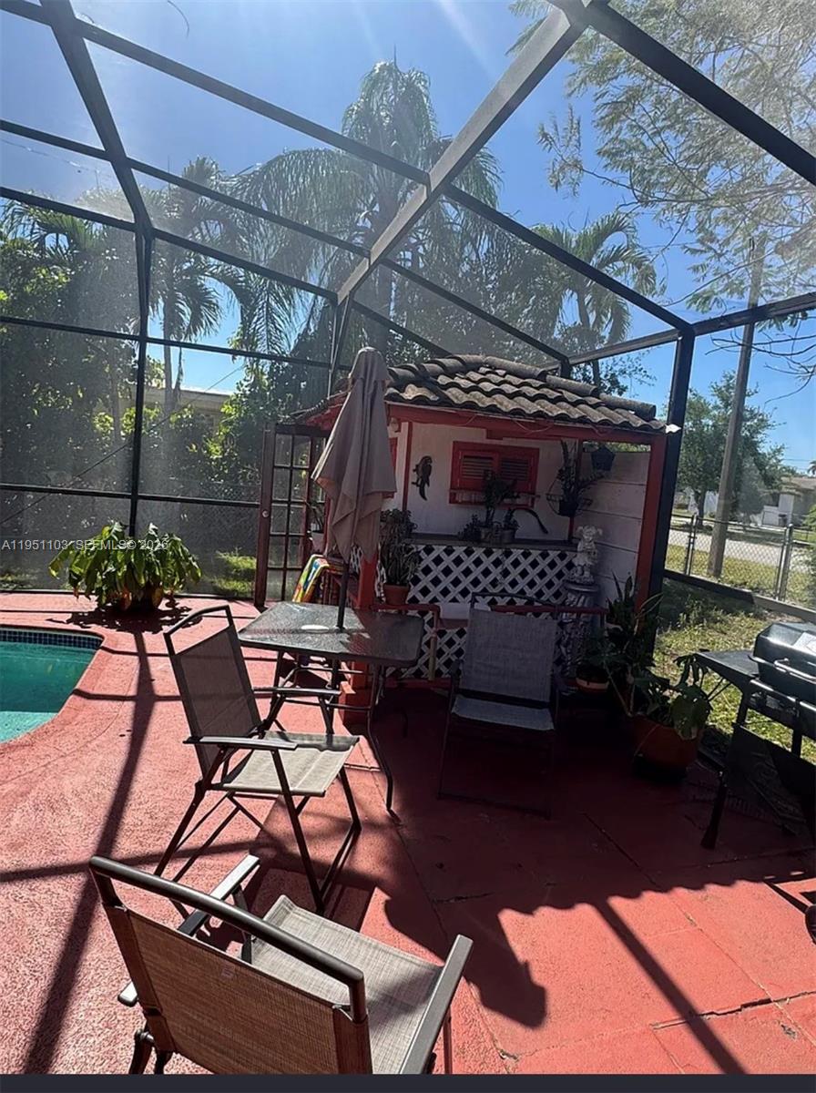 20530 Eagle Nest Road Cutler Bay, FL 33189 - Photo 13 of 17 a view of a chairs and table in a patio