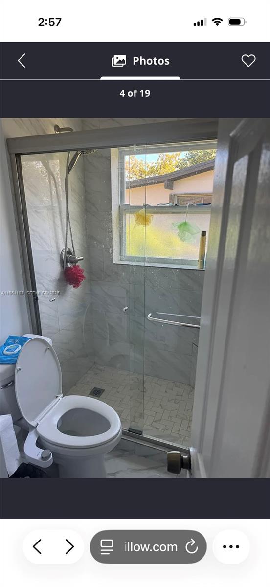 20530 Eagle Nest Road Cutler Bay, FL 33189 - Photo 14 of 24 a bathroom with a toilet and a shower