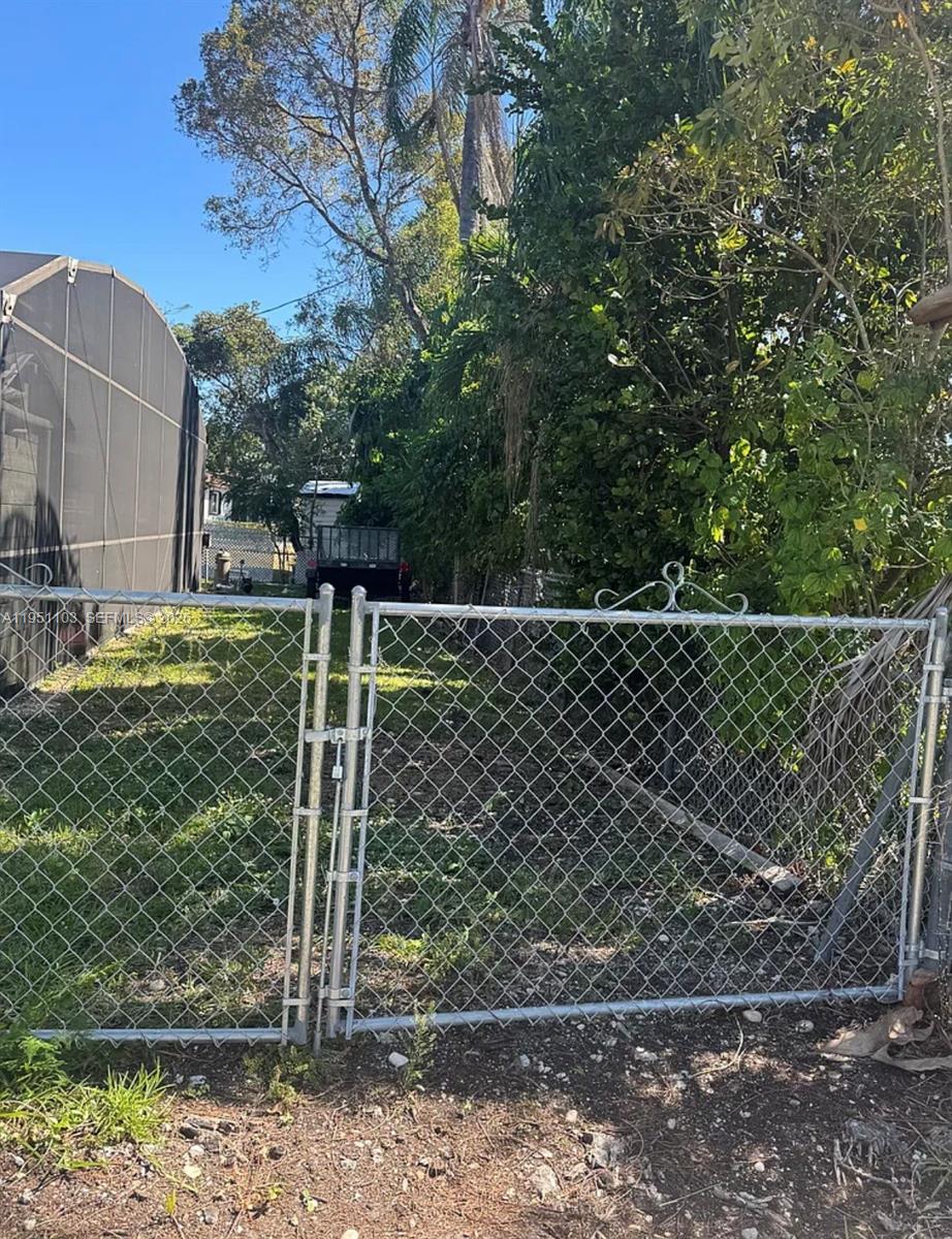 20530 Eagle Nest Road Cutler Bay, FL 33189 - Photo 15 of 17 a small yard with wooden fence