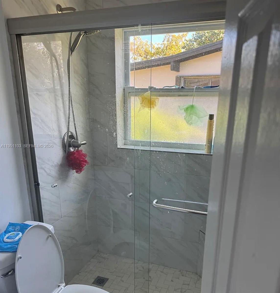 20530 Eagle Nest Road Cutler Bay, FL 33189 - Photo 17 of 17 a bathroom with a toilet and a shower