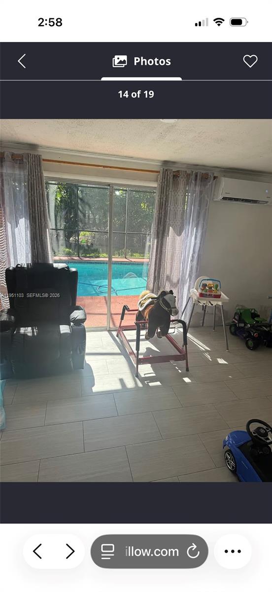 20530 Eagle Nest Road Cutler Bay, FL 33189 - Photo 18 of 24 a living room with a large window