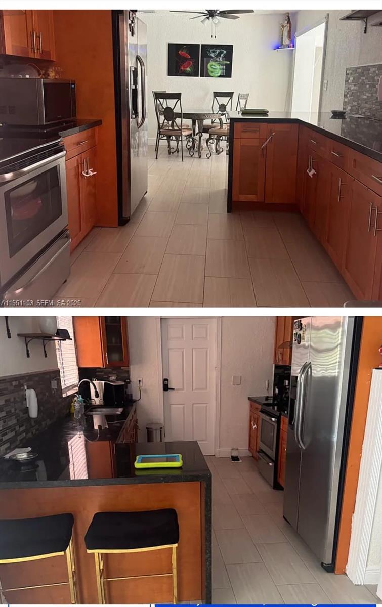 20530 Eagle Nest Road Cutler Bay, FL 33189 - Photo 2 of 24 a view of kitchen with furniture and wooden floor