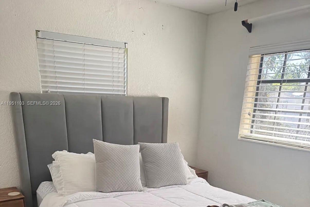 20530 Eagle Nest Road Cutler Bay, FL 33189 - Photo 7 of 17 a living room with furniture and a window