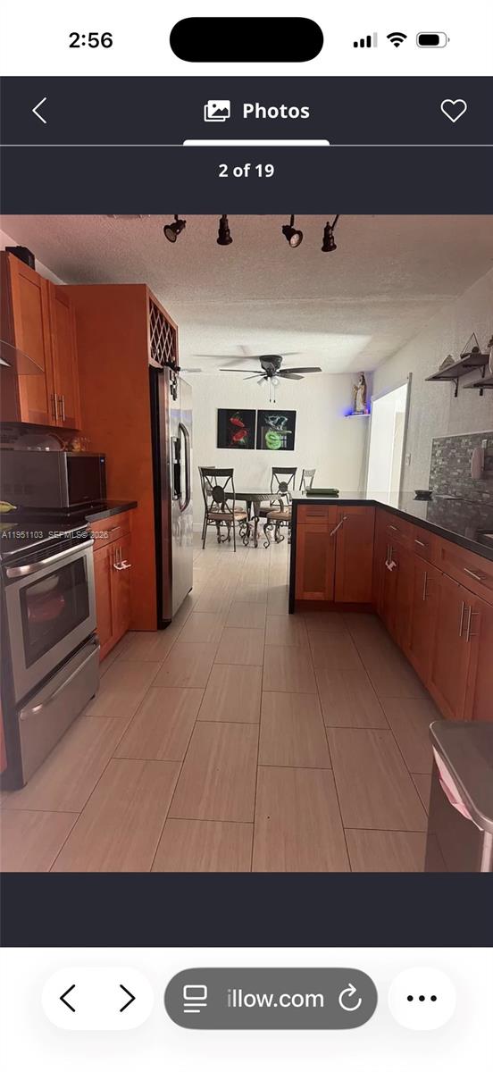 20530 Eagle Nest Road Cutler Bay, FL 33189 - Photo 10 of 24 a living room with furniture and a flat screen tv