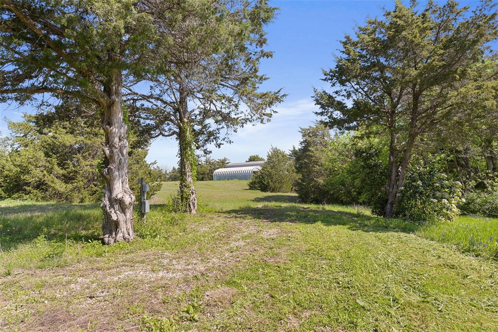 821 Ewing Road Ferris, TX 75125 - Photo 26 of 40 a view of backyard with green space