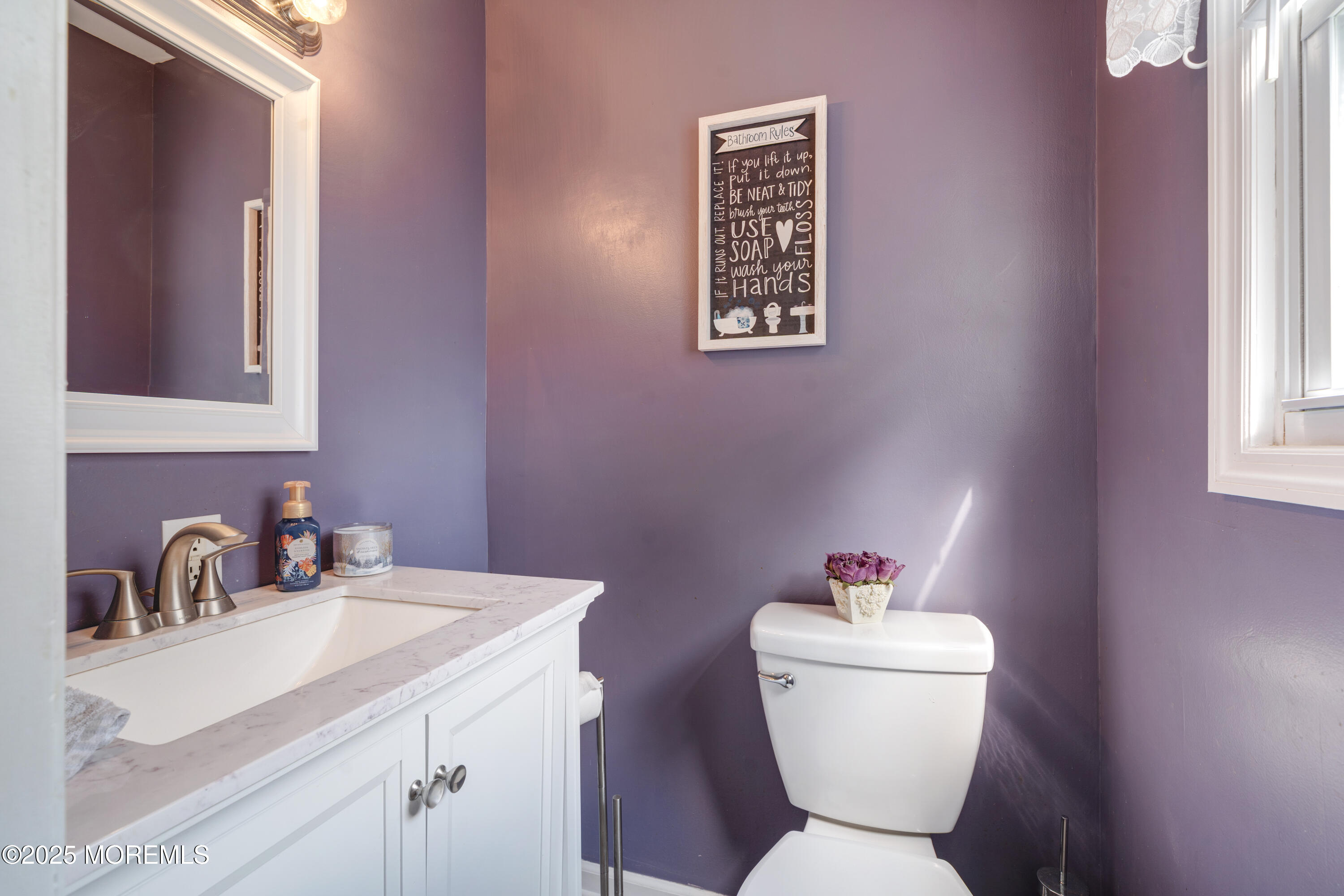 7 Carriage Road Hazlet, NJ 07730 - Photo 13 of 33 a bathroom with a toilet sink and mirror