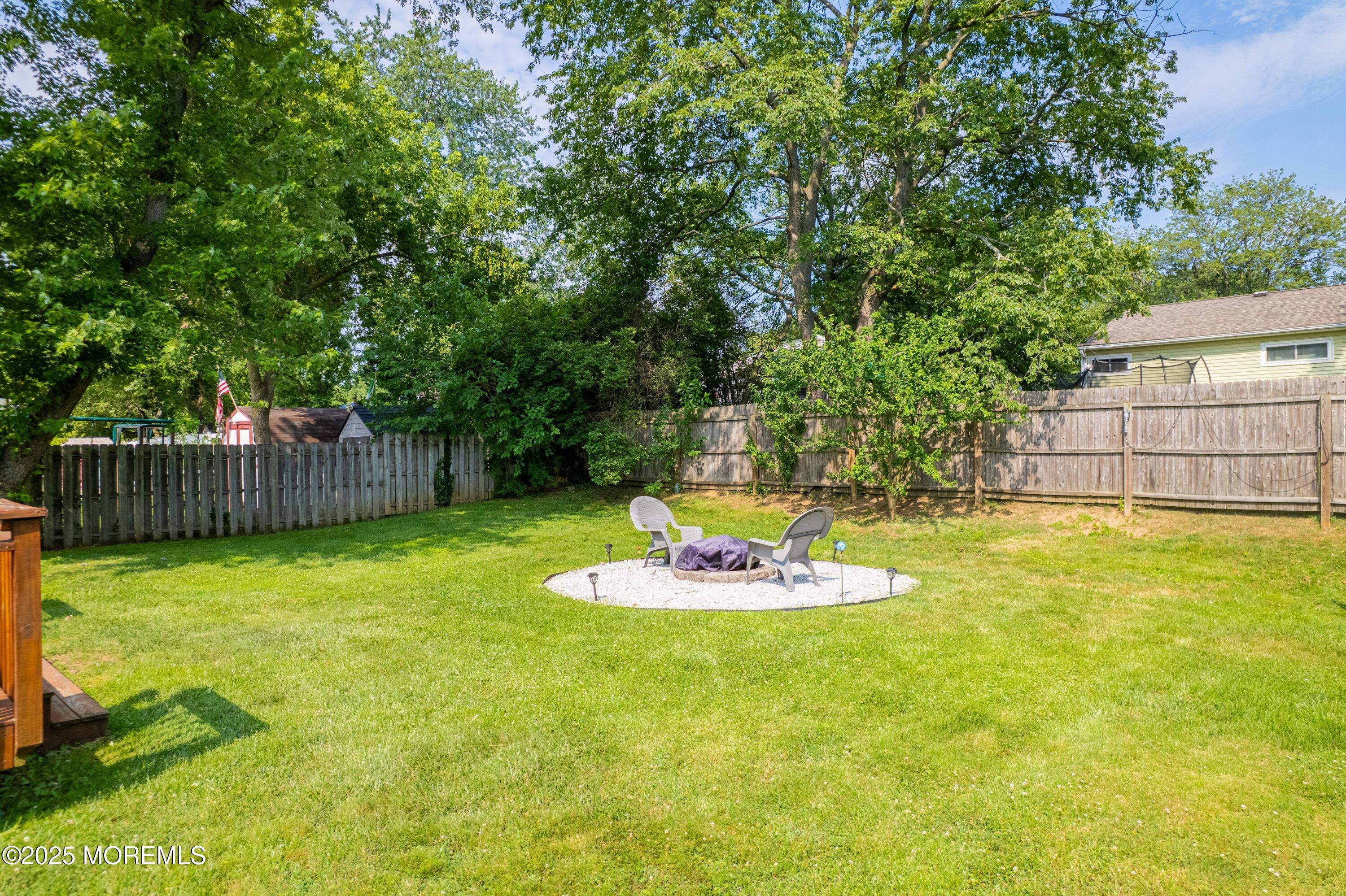 7 Carriage Road Hazlet, NJ 07730 - Photo 21 of 33 a table and chairs in the garden
