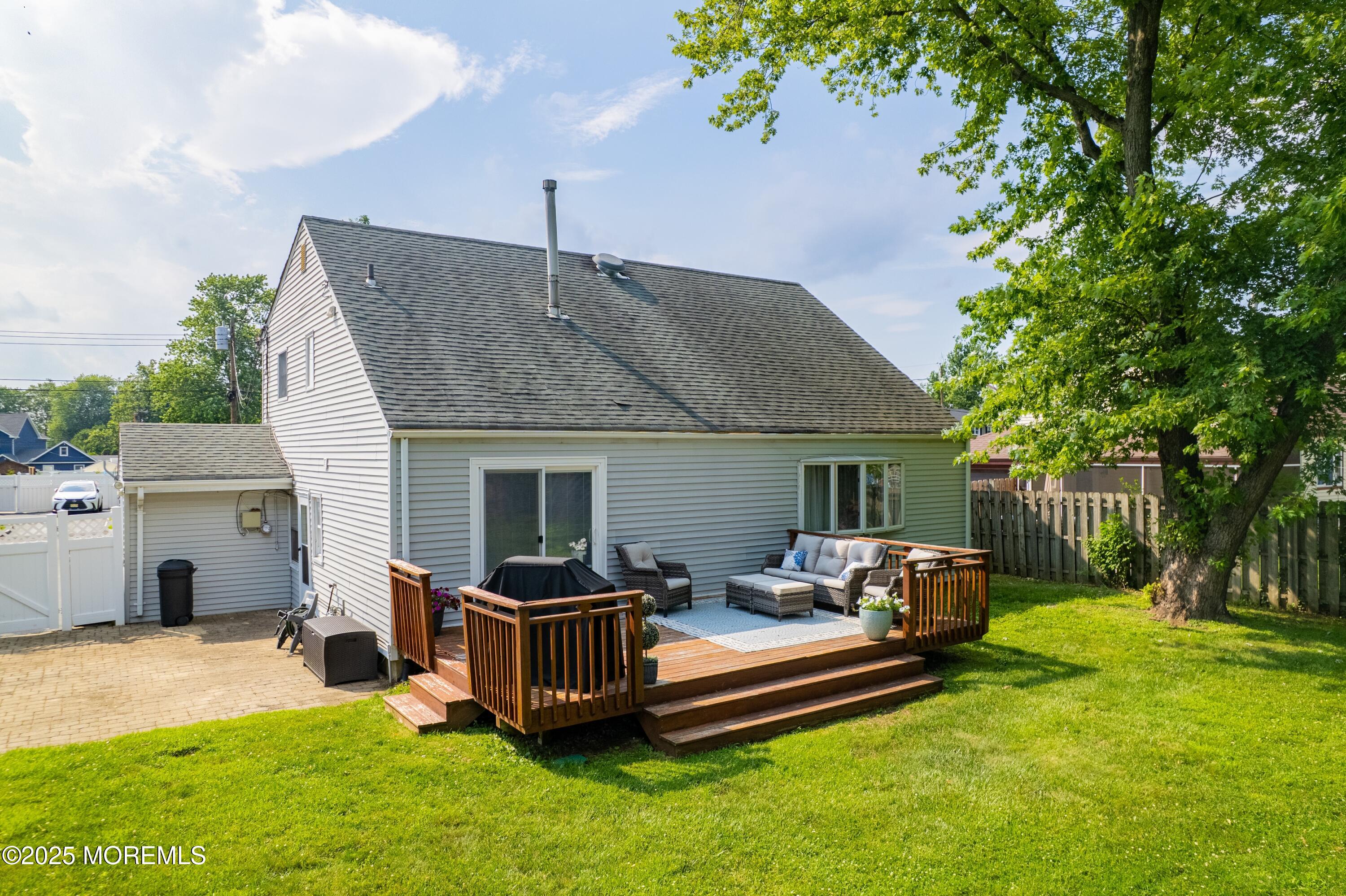 7 Carriage Road Hazlet, NJ 07730 - Photo 24 of 33 a view of a house with a chairs in a patio