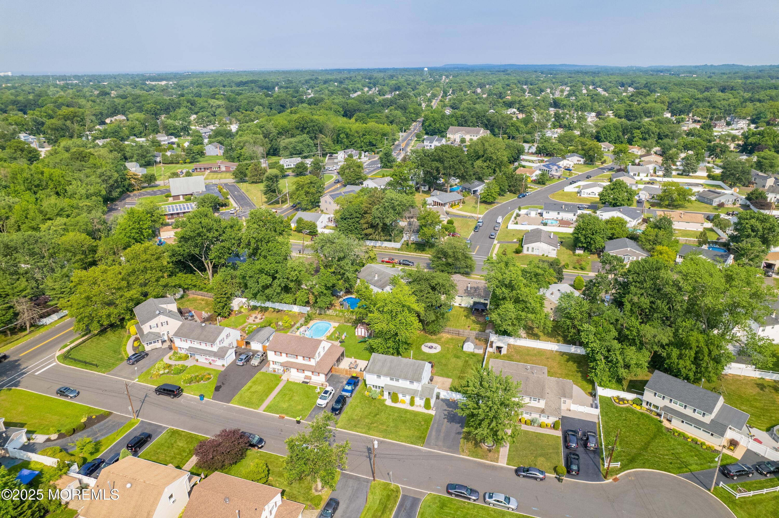 7 Carriage Road Hazlet, NJ 07730 - Photo 28 of 33 an aerial view of residential houses with outdoor space and trees all around