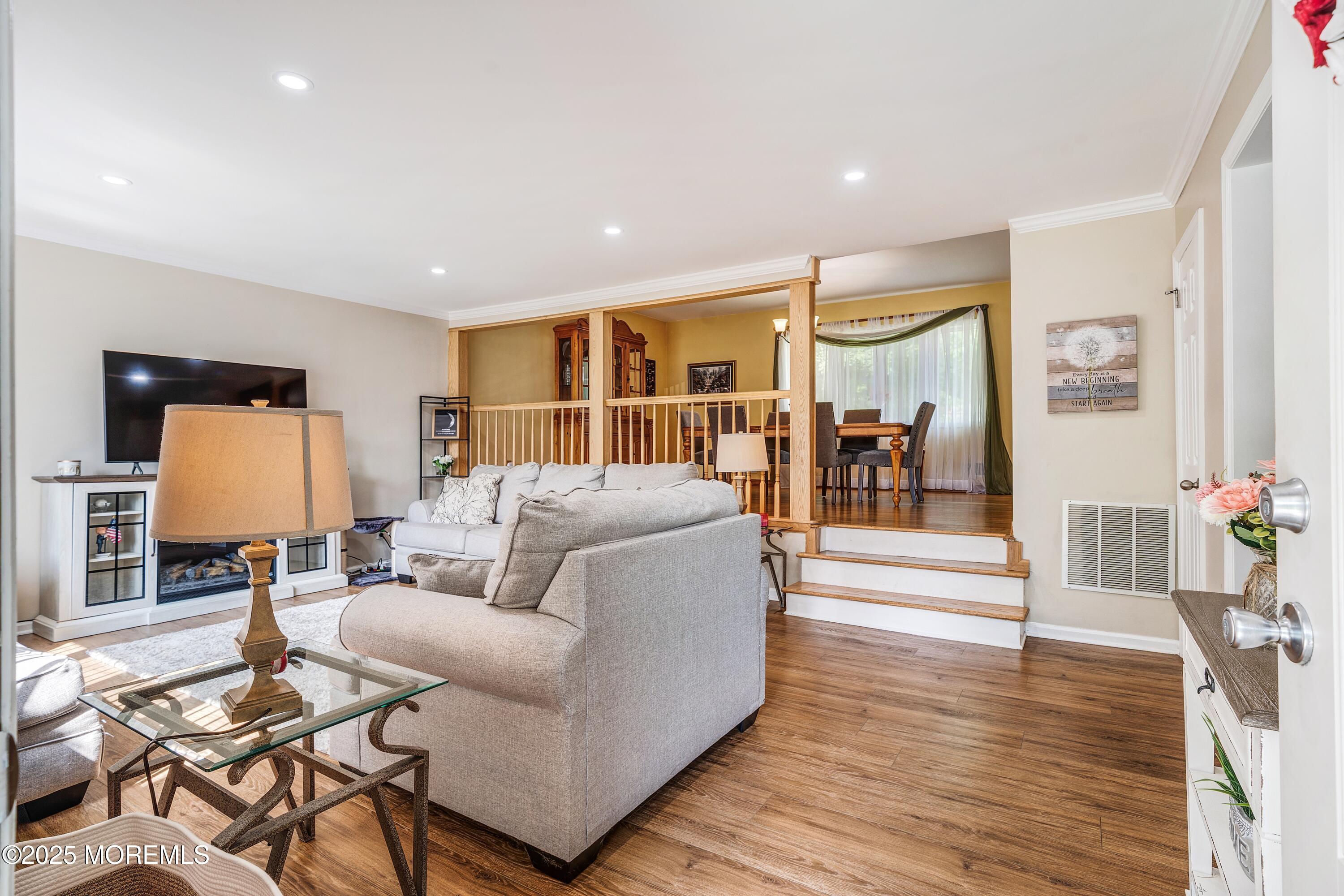 7 Carriage Road Hazlet, NJ 07730 - Photo 4 of 33 a living room with furniture and wooden floor
