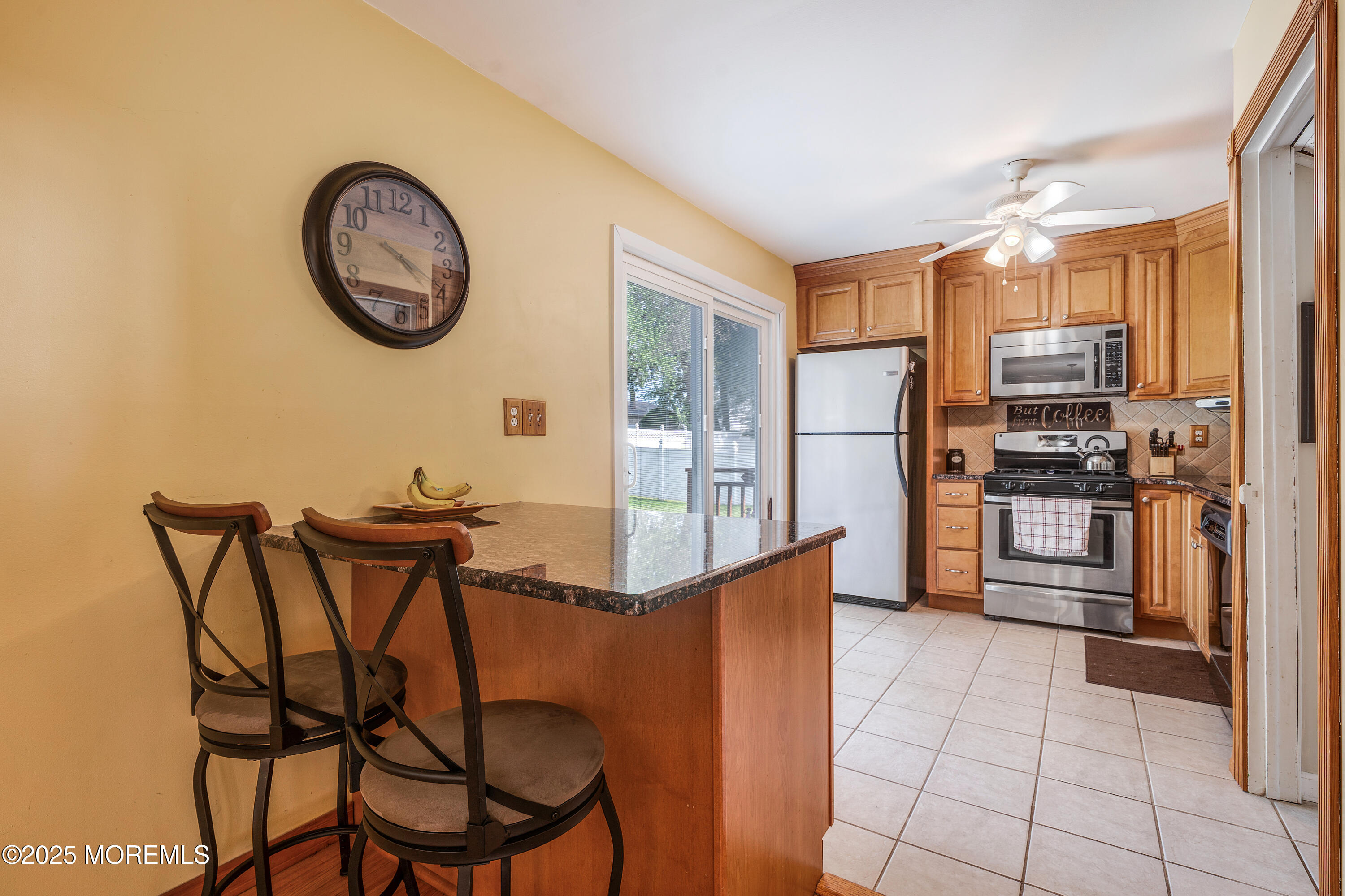 7 Carriage Road Hazlet, NJ 07730 - Photo 7 of 33 a kitchen with stainless steel appliances granite countertop a refrigerator and a stove top oven