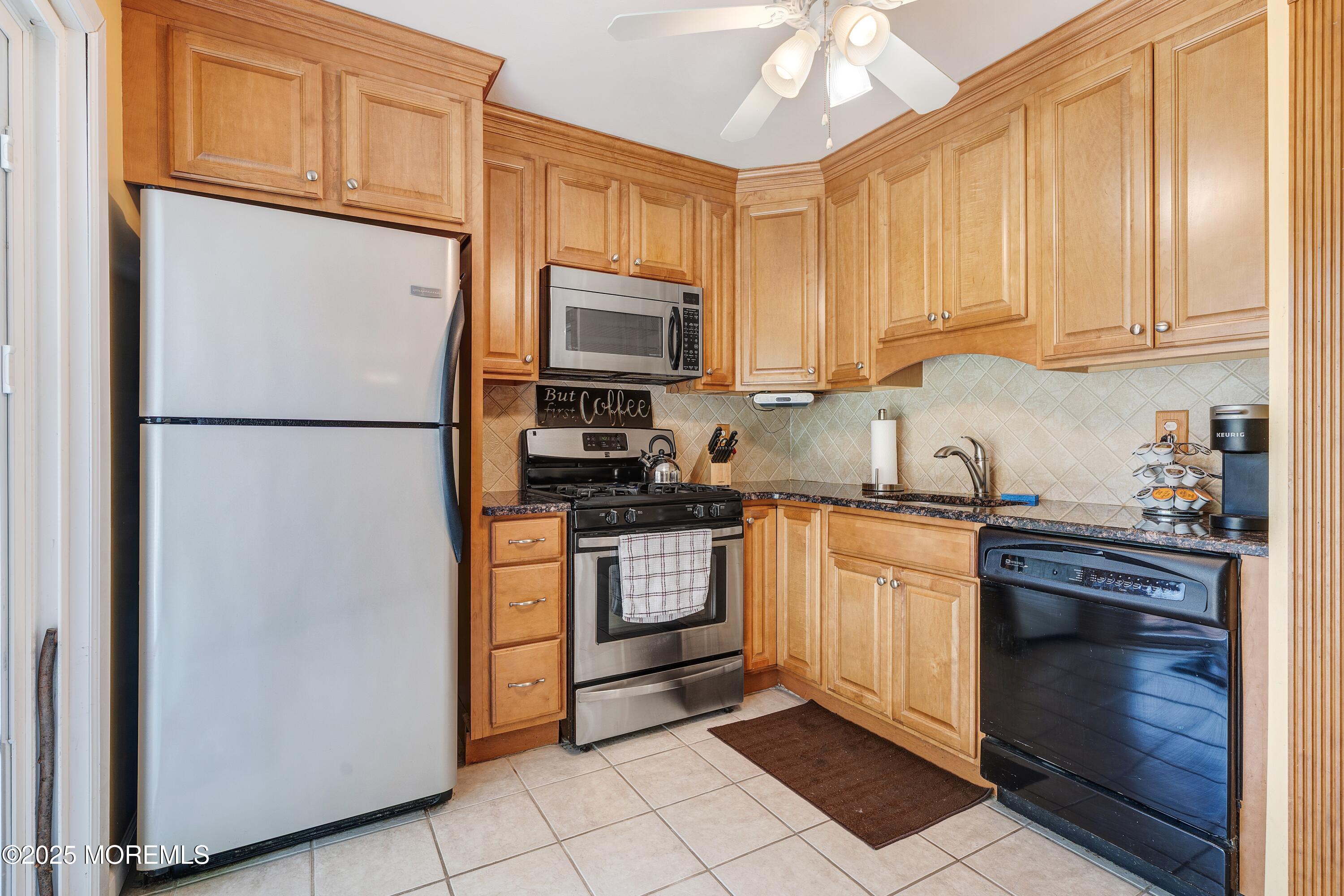 7 Carriage Road Hazlet, NJ 07730 - Photo 8 of 33 a kitchen with stainless steel appliances granite countertop a refrigerator stove a sink and dishwasher with a refrigerator