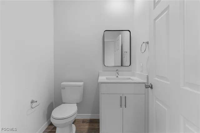 a bathroom with 2 sink and a mirror