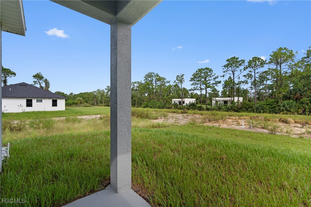 945 Butler Street East Lehigh Acres, FL 33974 - Photo 28 of 34 a view of a back yard