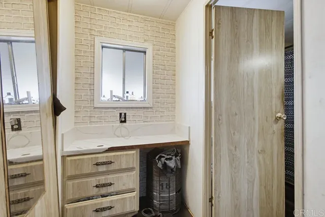 a bedroom with a bed and a walk in closet