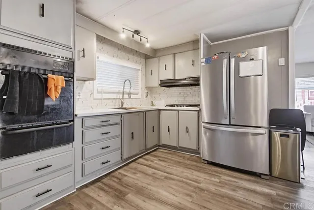 a view of a dining room with furniture and window