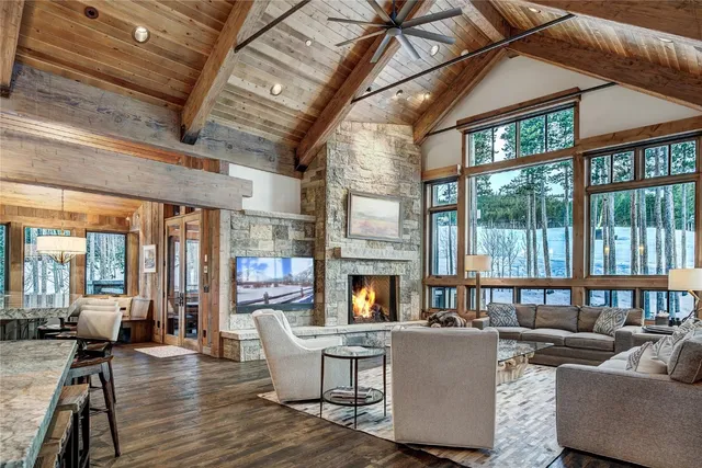 a living room with fireplace furniture and a flat screen tv