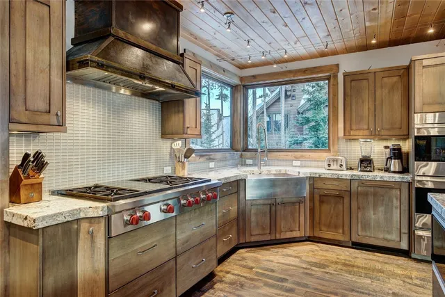 a spacious bathroom with a mirror sink and shower