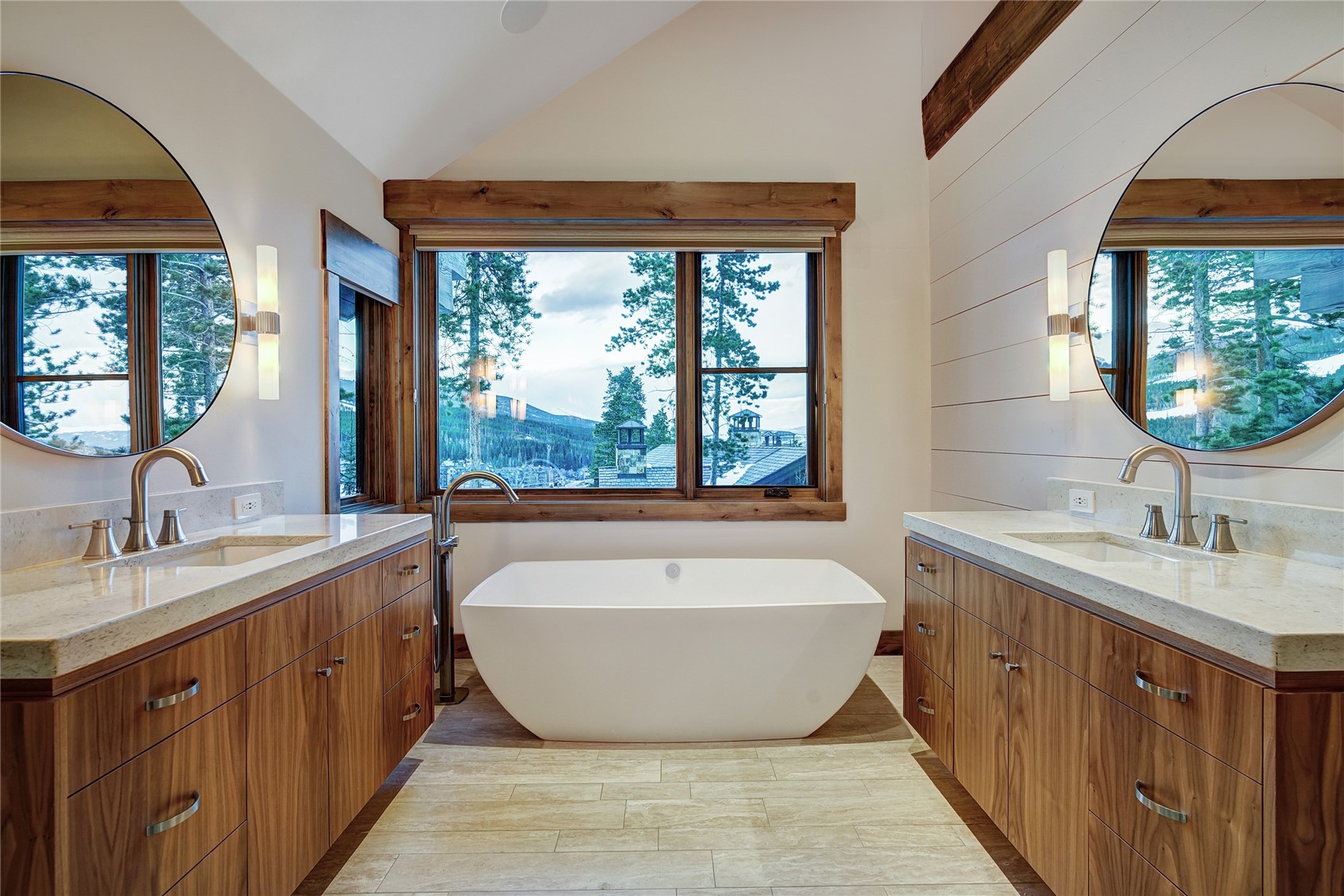 422 Timbertrail Road Breckenridge, CO 80424 - Photo 29 of 50 a spacious bathroom with a tub double sink large window and mirror