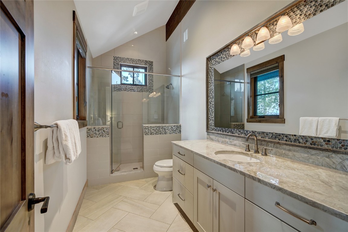 422 Timbertrail Road Breckenridge, CO 80424 - Photo 32 of 50 a spacious bathroom with a granite countertop sink toilet and shower
