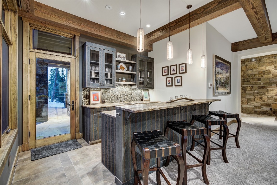 422 Timbertrail Road Breckenridge, CO 80424 - Photo 40 of 50 a kitchen with a table and chairs in it