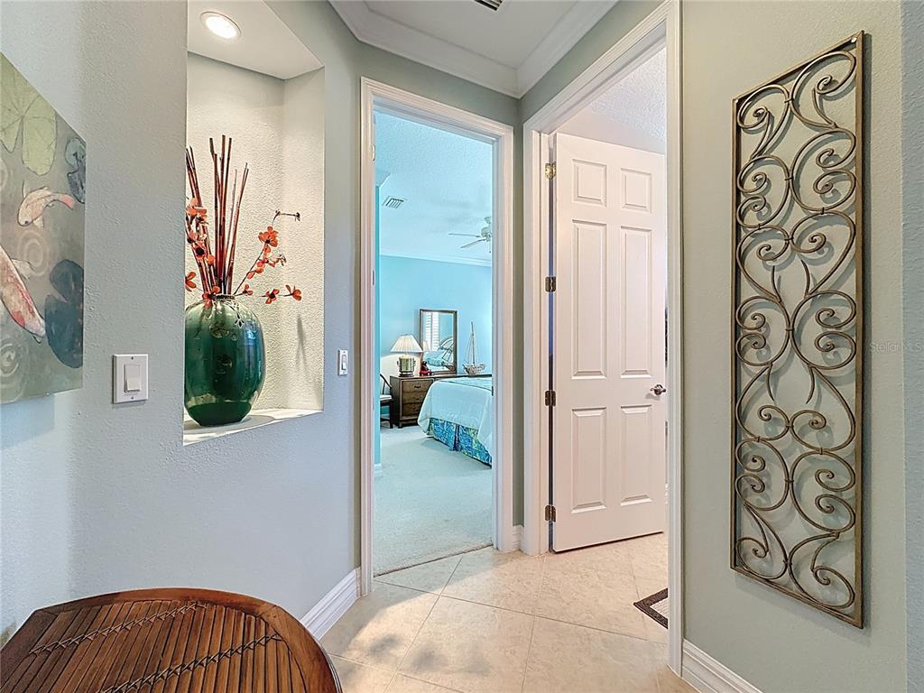 404 Silver Maple Road Groveland, FL 34736 - Photo 21 of 40 a view of a hallway and a livingroom and a hallway
