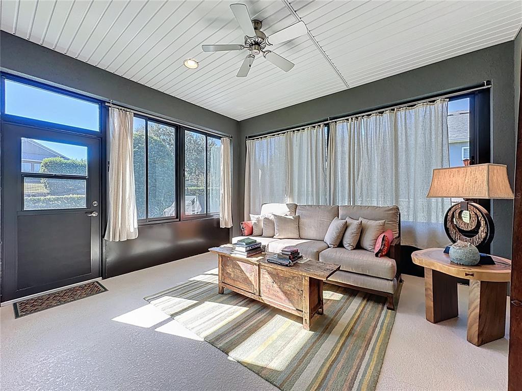 404 Silver Maple Road Groveland, FL 34736 - Photo 34 of 40 a living room with furniture and a large window